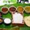 Rice, Sambar, Rasam, 1 Dry Sabji, 1 Gravy Sabji, Curd, Pickle, Payasam, Papadam Combo
