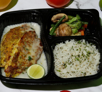 Grilled Fish In Lemon Butter Sauce With Sauteed Veggies And Herb Rice