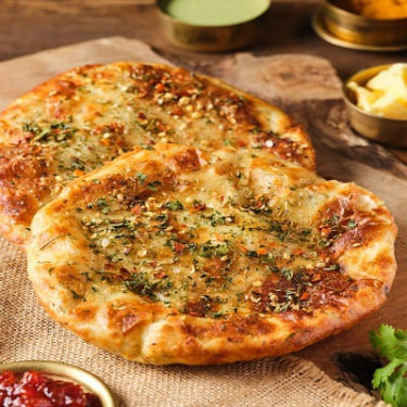 Aloo Pyaaz Kulcha Served With White Butter, Dal Makhani Tomato Murabba