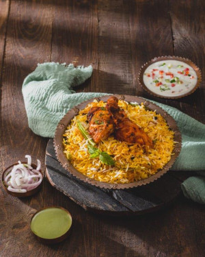 Dum Chicken Biryani Served With Raita Salad