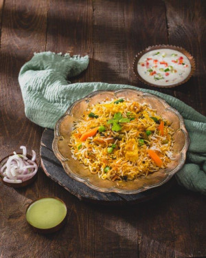 Dum Veg Biryani Served With Raita Salad