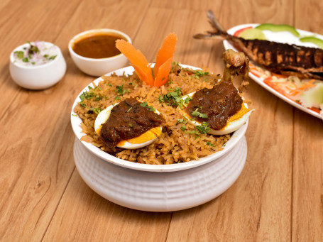 Chicken Dum Biryani Served With Raita And Salan