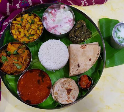 Traditional Maharashtrain Meals Jwar Roti Two Types Of Sabji Dal Rice With Papad Chasa And Salad