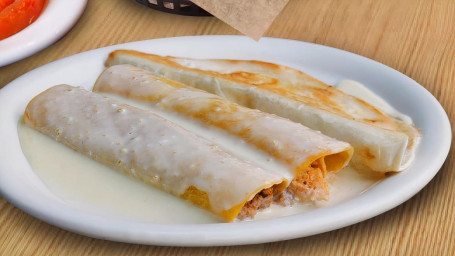 33. One Chicken Enchilada, One Beef Enchilada With Cheese Sauce, One Beef Taco And One Beef Quesadi