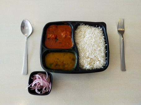 Veg Thali (Basmati Rice, Dal Fry, Paneer Butter Masala, And Onions)