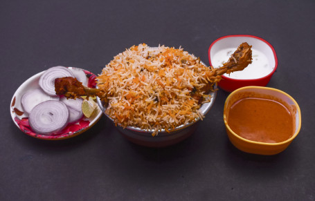 Chicken Dum Biryani (2 Pc) (Served With Raita ,Onion Salad And Gravy)