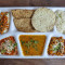 Punjabi Deluxe Thali [Paneer Vegetable Vegetable Curry Dal Rice Roti (2 pcs) Raita Papad Salad Buttermilk Sweet]