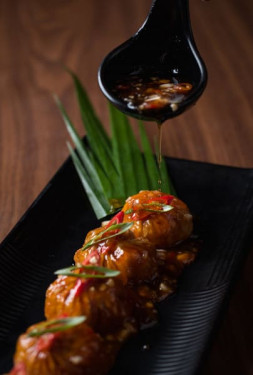 Veg Steamed Dimsum With Black Pepper Sauce