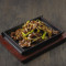 Sizzling Sliced Beef With Spring Onion On Hot Plate