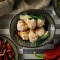 Pork And Vegetable Dumplings In Our Artisanal Chilli Sauce Hóng Yóu Chāo Shǒu (6 Pieces)