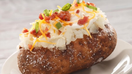 Loaded Baked Potato With Cheese, Bacon, And Green Onions