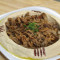 Hummus with Pita Bread Topped with Steak