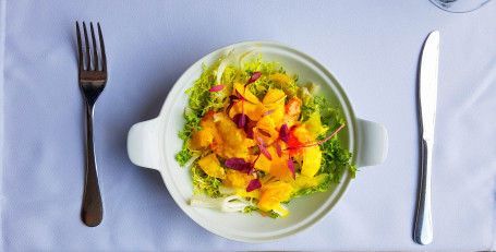 Citrus Segment Salad On Mix Leaves And Mustard Dressing