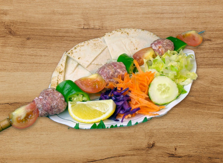 K01C Tomato Beef Kebab With Rice Or Chips Or Salad