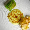 Rana pescatrice, verza, salsa al curry verde e sedano rapa in carpione