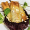 Involtini Di Pasta Filo Con Tonno Pinne Gialle, Verdure Saltate E Mandorle