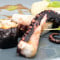 Poulpe rôti tendrement, homard breton en feuille de nori, fenouil doux et vinaigrette de salicorne