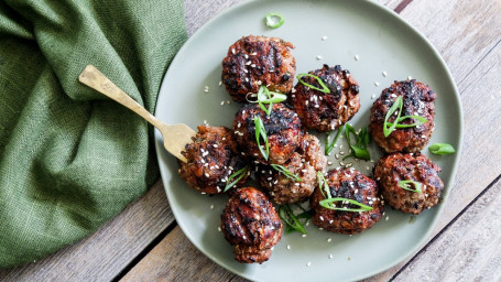 Side Meatballs With Marinara Sauce And Parmesan Cheese