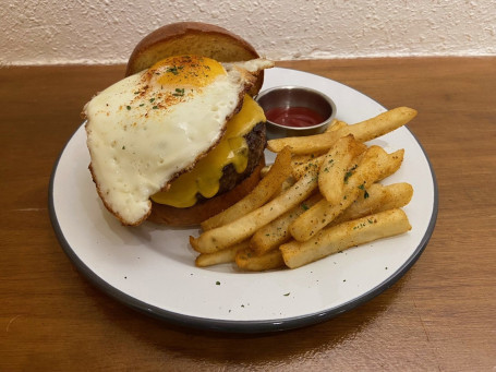 Wagyu Beef Burger (Wagyu Beef Patty, Portobello, Caramelized Onion, Sunny Egg And Cheddar Cheese) With Fries