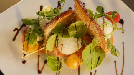 Mini Mozzarella, Balsamic Vinegar, Tomato, Sourdough Bread Crisp, Lettuces, Pesto