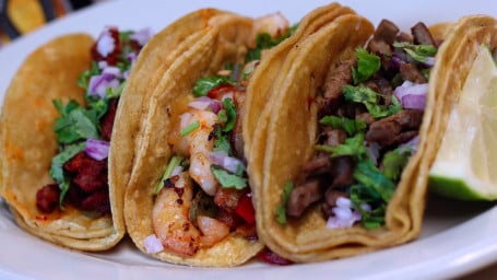 27. Pastor, Steak, Crab, Chorizo or Shrimp Tacos (3)